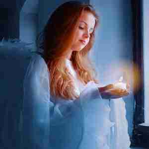 Beautiful Angel Holding A Candle