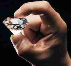 Closeup of person holding an unbreakable diamond