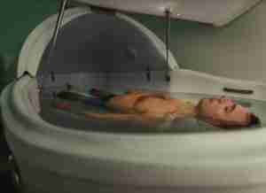 Man Relaxaing in a Therapeutic Float Tank