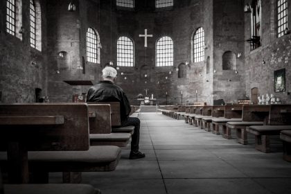 Man Praying In Church