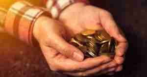 Man Holding Pennies