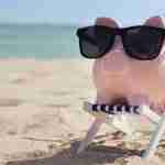 Piggy Bank On Beach Wearing Sunglasses