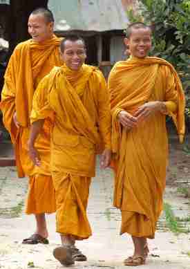 Three Laughing Monks Walking In Orange Robes