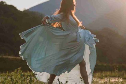 Woman Dancing Outside In White Dress