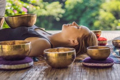 Woman Lying Down Listening to Tibetan Singing Bowls