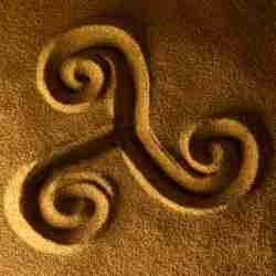 Celtic Triskelion Symbol Drawn in the Sand