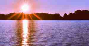 Beautiful Purple Sunrise Over Water